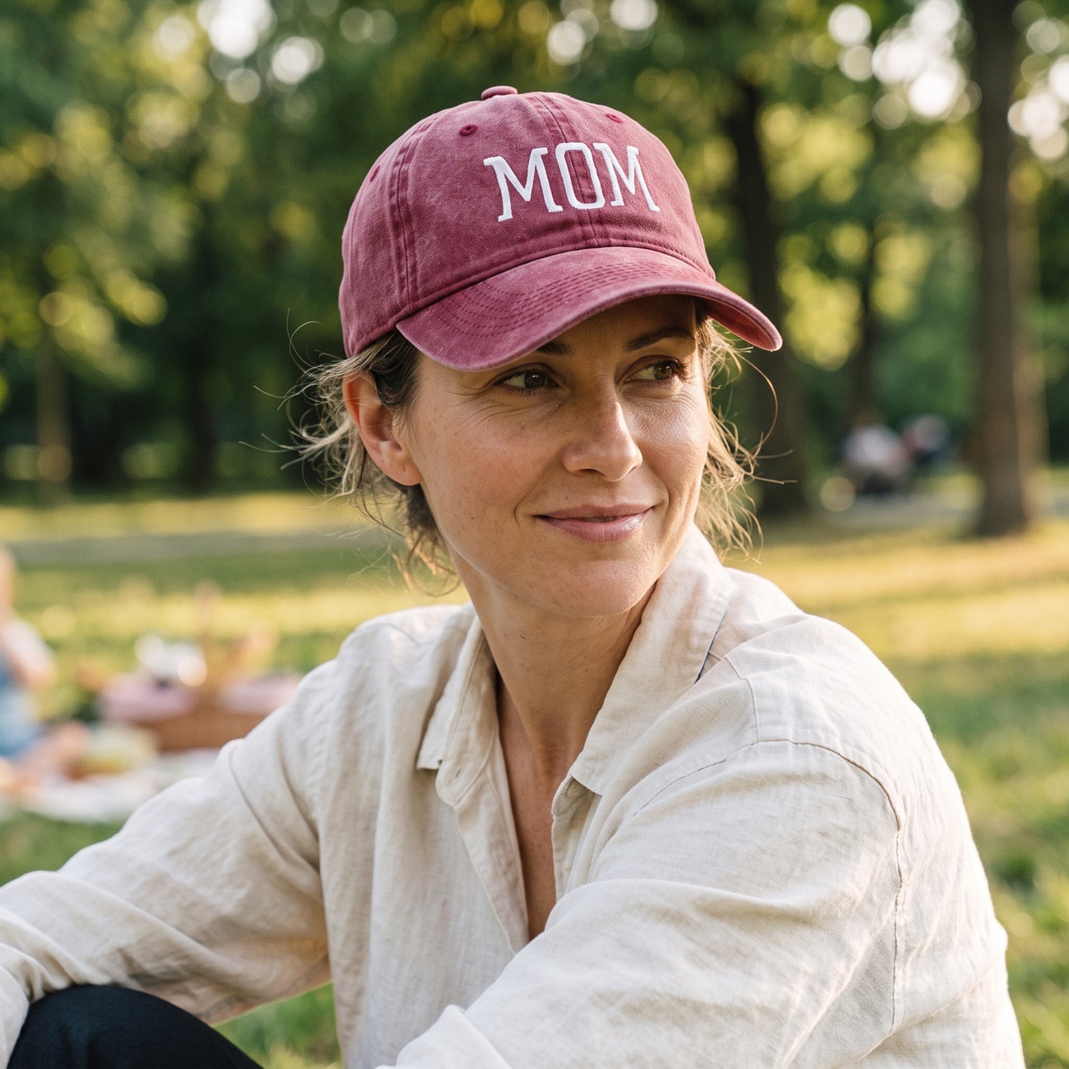 Mum wearing her Red MOM cap on a family picnic